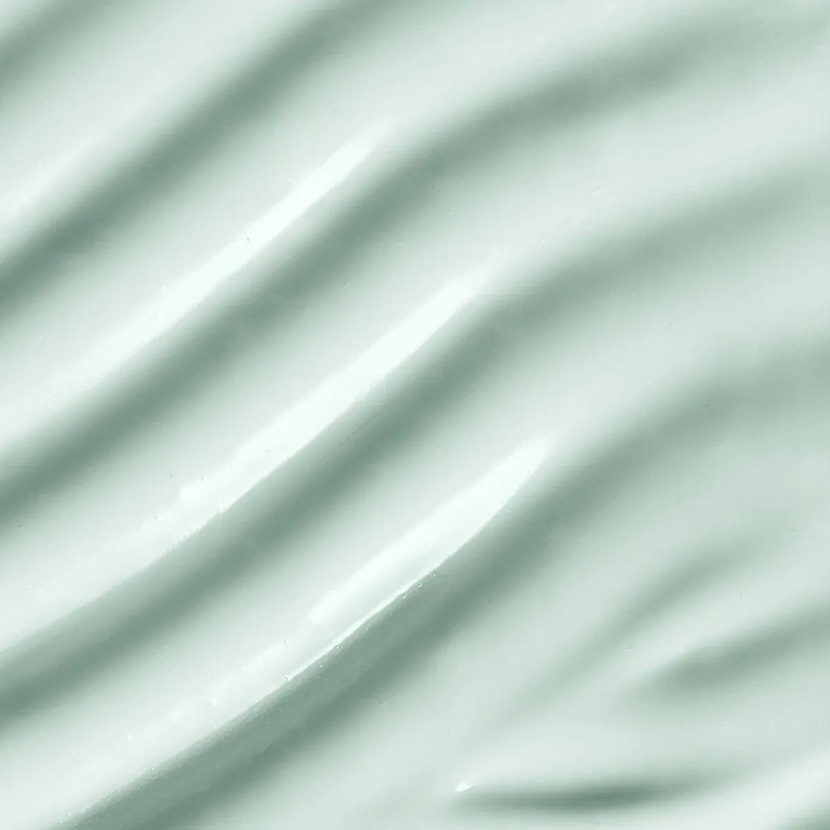 Macro view of the serum's light gel-cream texture