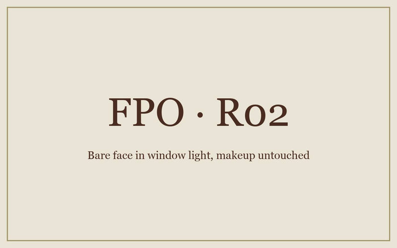 FPO: a bare face in window light, makeup still untouched on the counter.