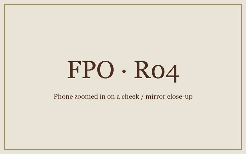FPO: a hand holding a phone, zoomed in on a cheek.