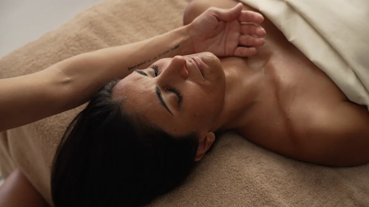 Person reclining with damp skin before cleansing
