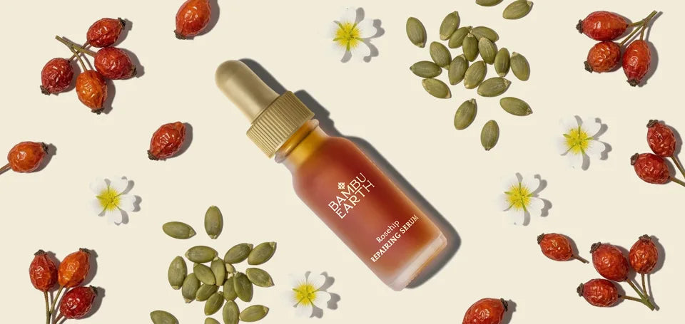 Rosehip Repairing Serum bottle with rosehips, pumpkin seeds, and meadowfoam blossoms