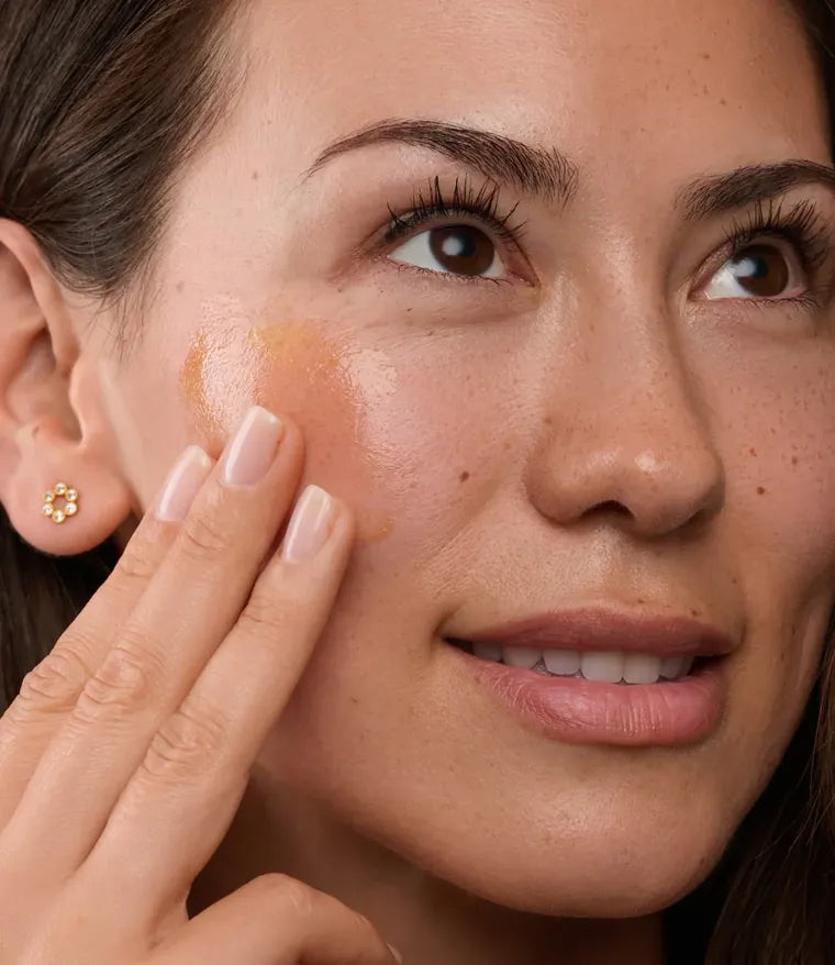 Woman applying Advanced Antioxidant Renewing Gel to her cheek